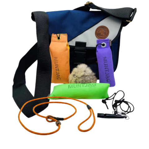 Dog training equipment set with a blue bag, orange, green, and purple Muntjac dummys on a white background.