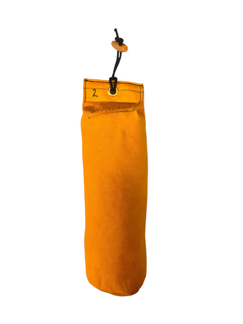 Orange gundog dummy with a black toggle on a white background