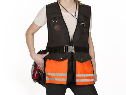 front view of the brown waxed profi vest showing orange treat bag pocket insertsnon white background 