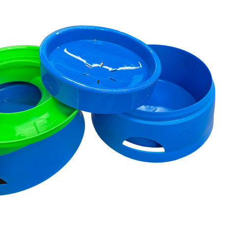 Two blue and green plastic bowls on a white background