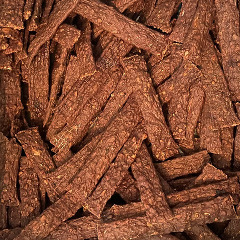 Close-up of brown dog treats stacked together