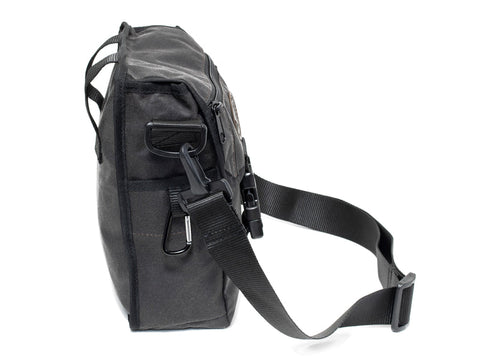 brown waxed mini deluxe bag on a white background 