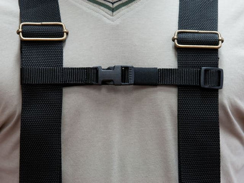 Close-up of training vest strap with buckles on a beige background