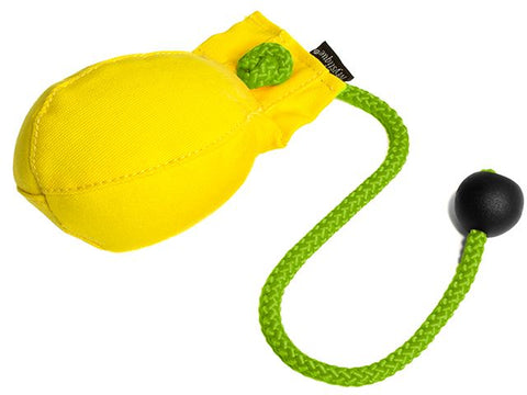 A yellow canvas dummy ball with a bright green braided rope and a black toggle, shown on a plain white background.