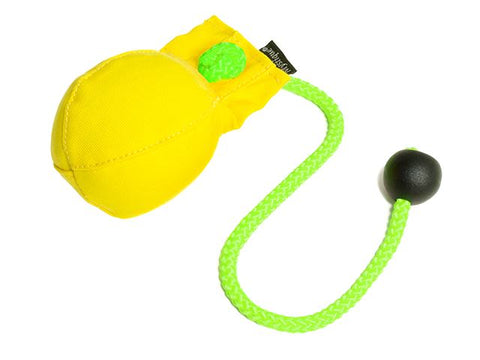 A yellow canvas dummy ball with a bright green braided rope and a black toggle, shown on a plain white background.