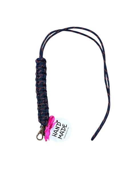 Navy & Red braided lanyard with a tag labeled 'Hand Made' on a white background