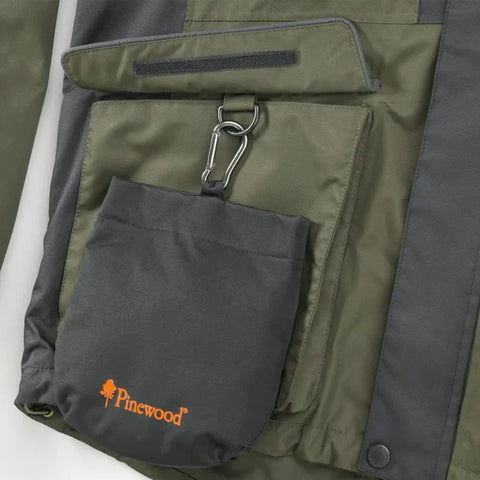 Close-up of a green and gray jacket with a carabiner and small pouch featuring the Pinewood logo.