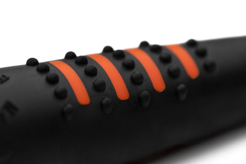A black and orange Acme whistle for sale at Muntjac Trading